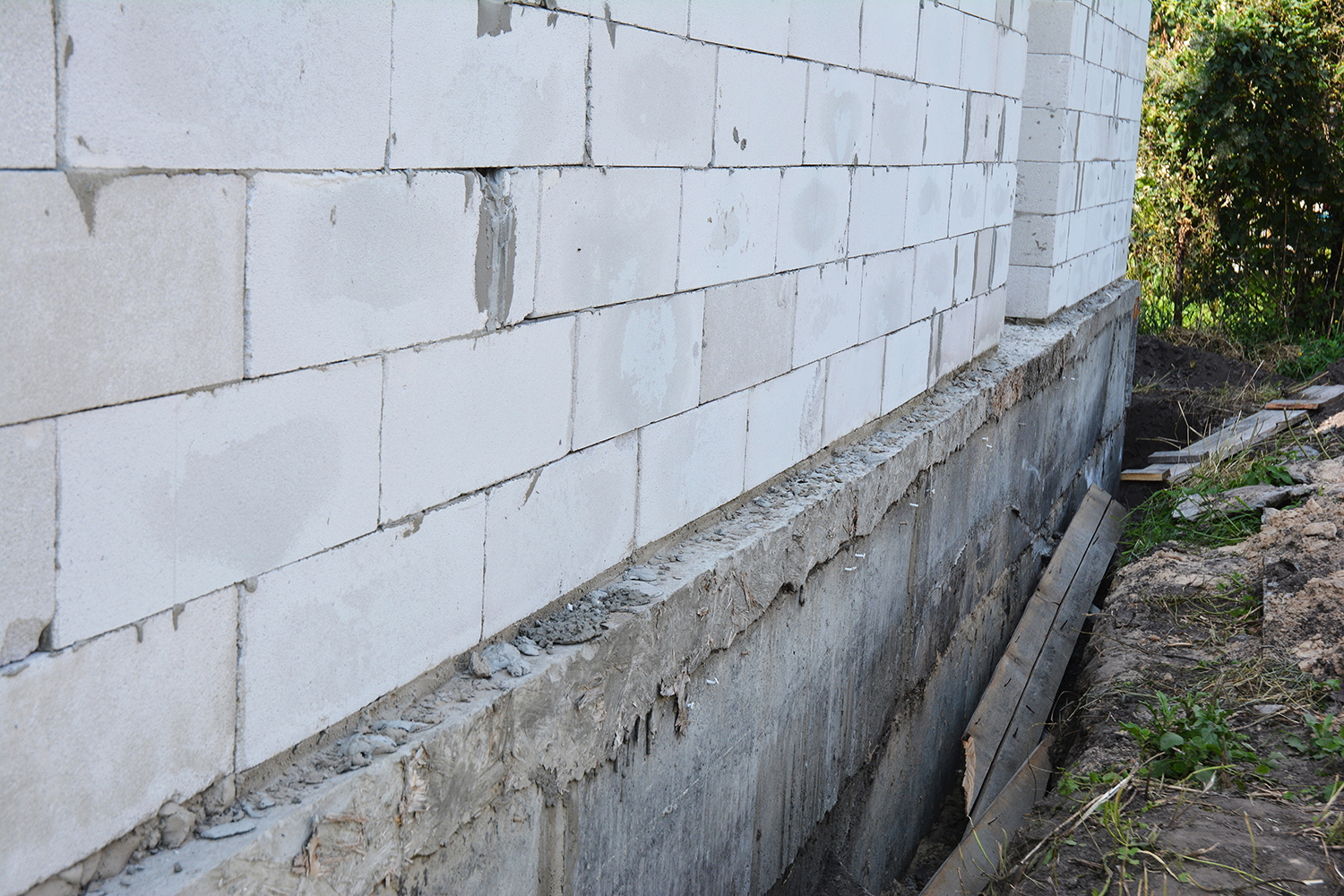 House wall ready for waterproofing foundation with insulation