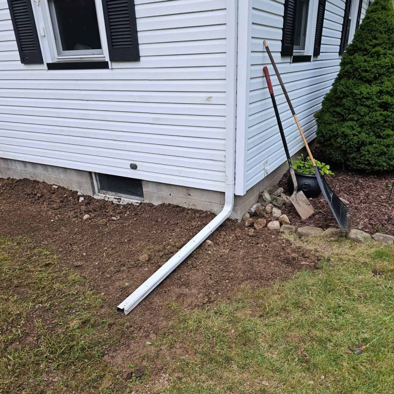 Trench dug along home foundation to begin foundation repairs