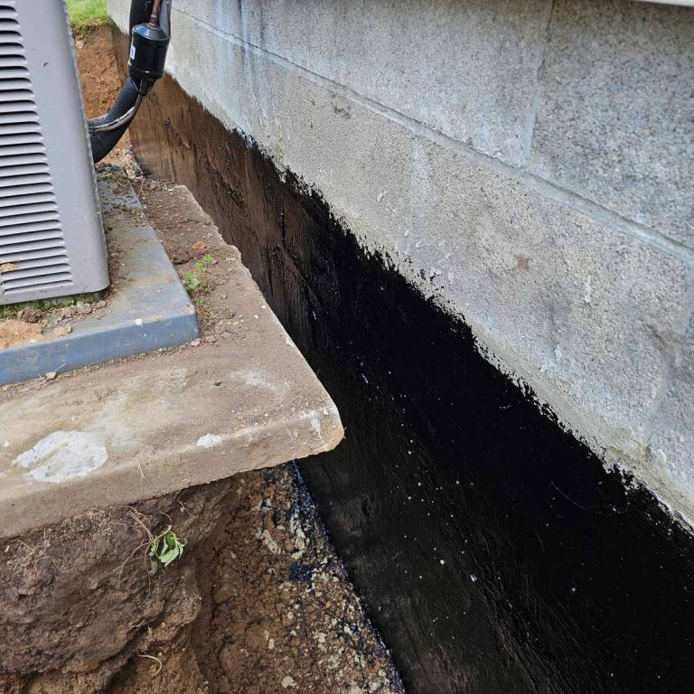 Trench dug along home foundation to begin foundation repairs